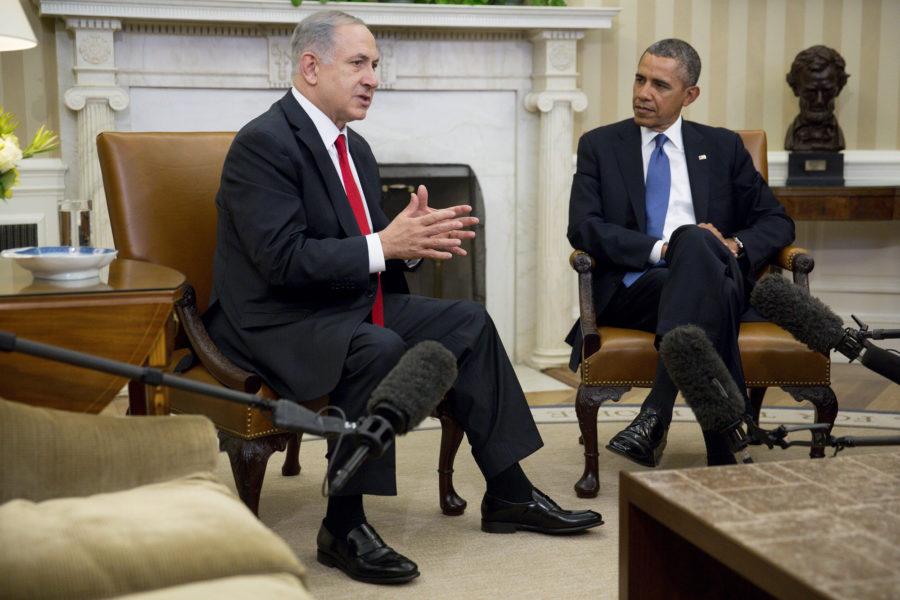 U.S. President Barack Obama (right) watches as Israeli Prime Minister Benjamin Netanyahu speaks in the Oval Office of the White House in Washington, D.C., on Monday, March 3, 2014. Obama urged Netanyahu to "seize the moment" to make peace, saying time is running out to negotiate an Israeli-Palestinian agreement. (Pool photo by Andrew Harrer/Bloomberg via Abaca Press/MCT)