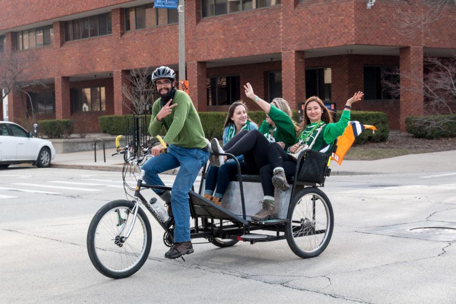 Three girls get a ride to Kam's during Unofficial on March 4, 2016.