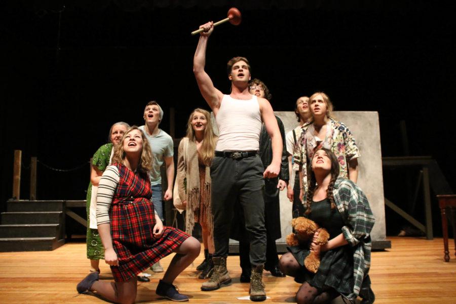 The cast of Urinetown on stage at Gregory Hall this past weekend. The musical portrays a town whose tyrannical government motivates them to revolt against social injustices.
