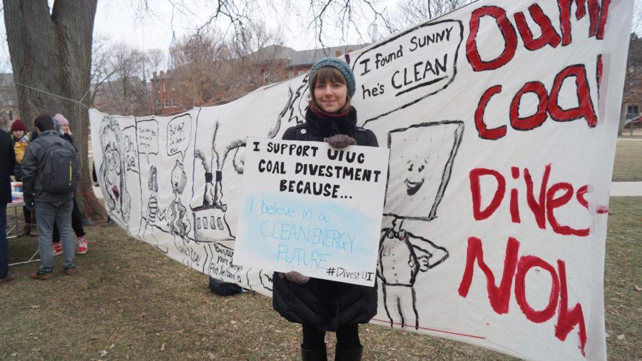 Sophomore Julia Nikolaev shows support for UIUC Beyond Coal student organization which stages a Break Up With Coal protest on the main quad on Friday, Feb. 13, 2015.