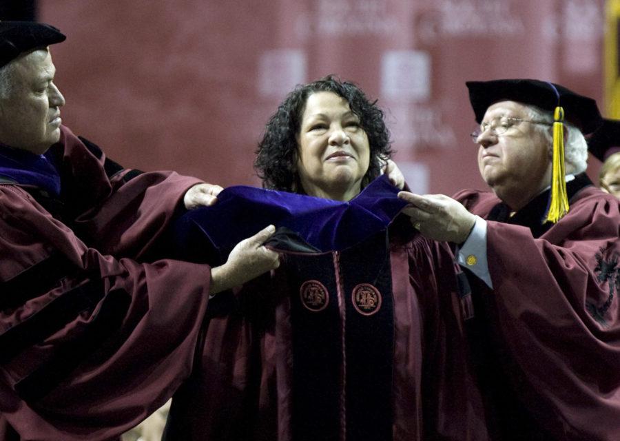 University of South Carolina Chairman of the Board of Trustees, Miles Loadholt, left, and Board Secretary, Thomas Stepp, peform the hooding of U.S. Supreme Court Justice Sonia Sotomayor, before she delivered the commencement address to South Carolina graduates at the Colonial Life Arena in Columbia, South Carolina, Friday, May 6, 2011. (C. Aluka Berry/The State/MCT)