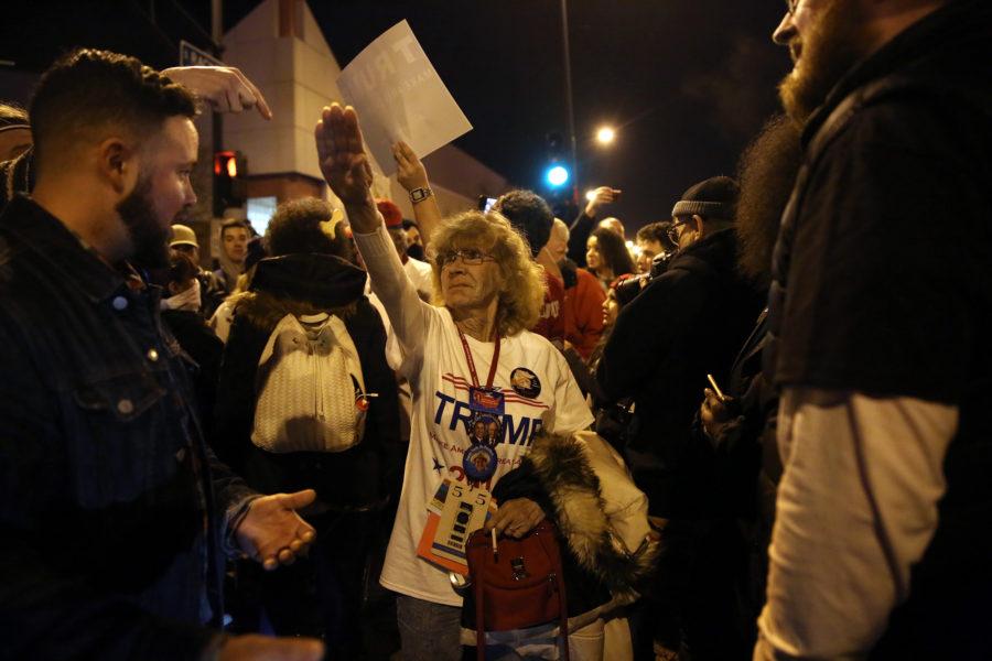 Donald Trump supporter Birgitt Peterson of Yorkville, Ill., argues with protesters outside the UIC Pavilion after the cancelled rally for the Republican presidential candidate in Chicago on Friday. (E. Jason Wambsgans/Chicago Tribune/TNS)