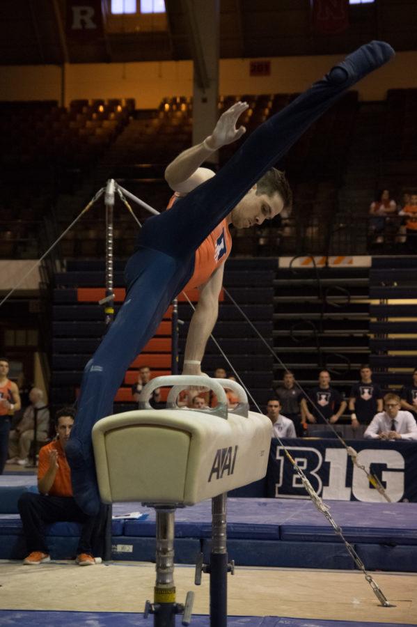Illinois Logan Bradley performs his routine on the pommel horse at the meet against Michigan on March 12, 2016.