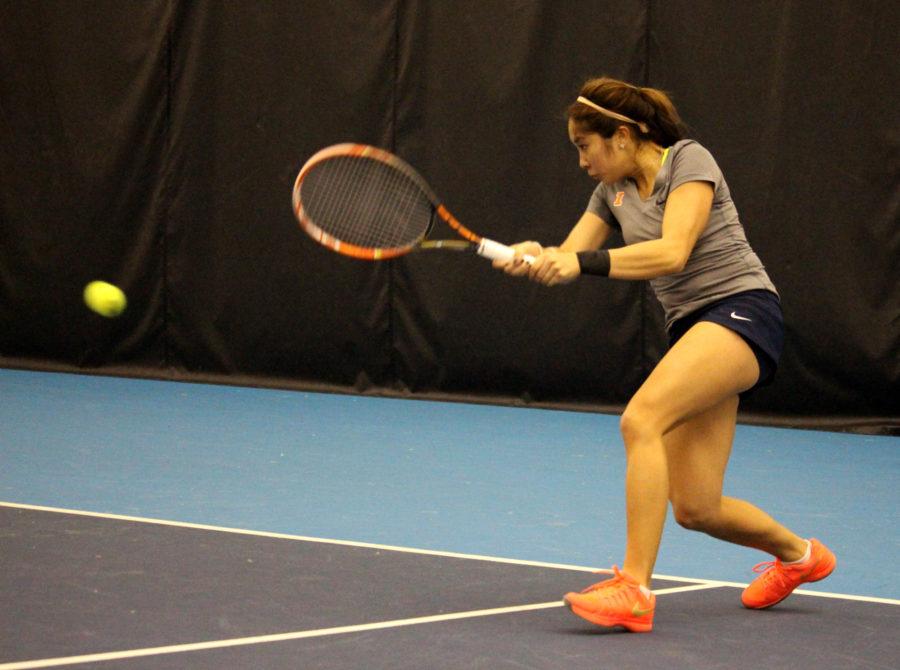 Louise Kwong does a two handed rally at the Atkins Tennis Center on Febrary 26, 2016 against Northwestern. Illini lost 3-4.