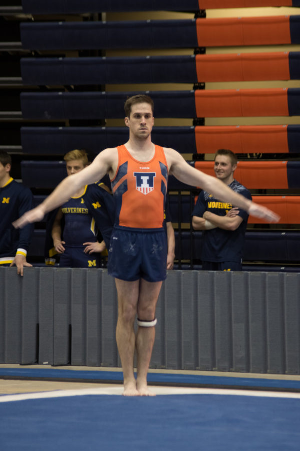Illinois Logan Bradley pauses in his routine at the meet against Michigan on March 12, 2016.