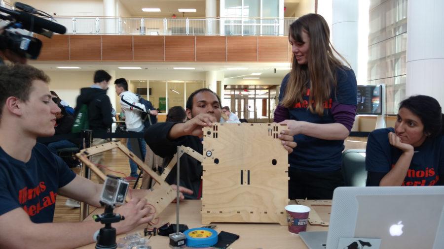 Students participate in the 3D Printer build event at the Business Instructional Facility on March 30, 2016. The event was held to help promote the rise of 3D printing and modeling. 
