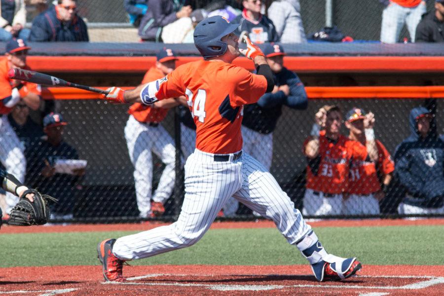 Illinois’ Jason Goldstein watches the ball fly towards left field after hitting a solo home run during game one of the team's doubleheader against Penn State at Illini Field on Saturday, March 26. The Illini won game one 6-1 and lost game two 5-3.