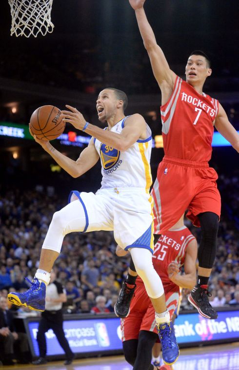 The Golden State Warriors Stephen Curry drives to the hoop against the Houston Rockets Jeremy Lin (7) in the first half at Oracle Arena in Oakland, Calif., on Thursday, Feb. 20, 2014. (Doug Duran/McClatchy-Tribune)