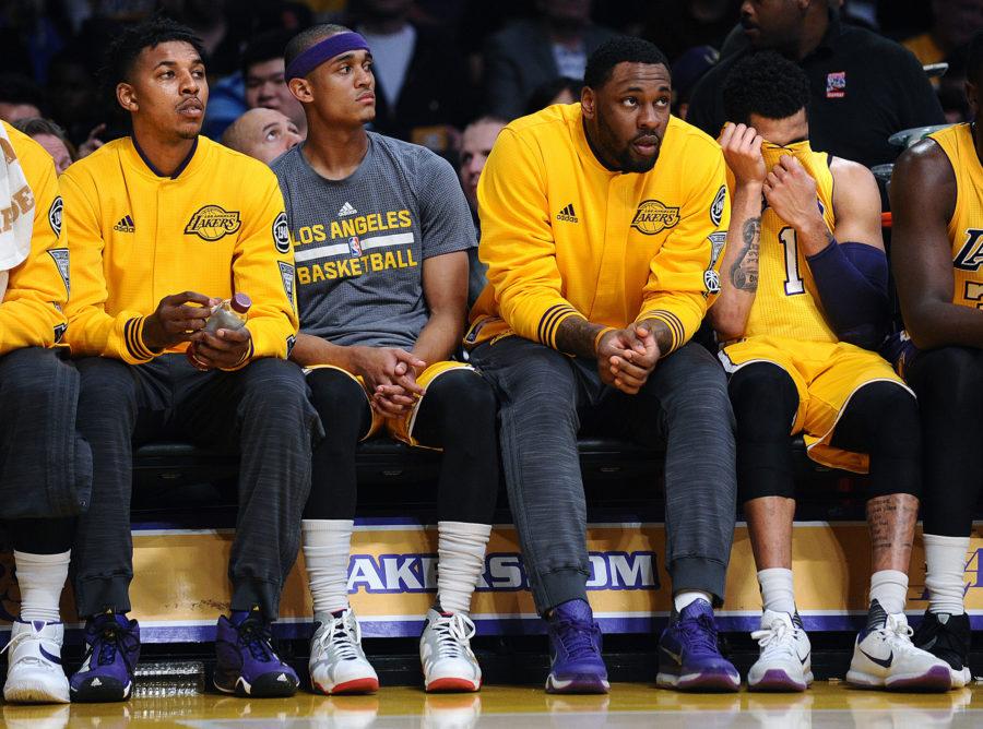 The Los Angeles Lakers' Nick Young, left, and teammate D'Angelo Russell, right, sit apart from each other on the bench during a game against the Miami Heat at Staples Center in Los Angeles on Wednesday, March 30, 2016. (Wally Skalij/Los Angeles Times/TNS)