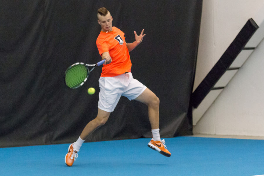 Illinois+Brian+Page+swings+for+the+ball+during+the+match+against+Wisconsin+at+the+Atkins+Tennis+Center+on+Sunday%2C+April+3.+The+Illini+won+4-0.