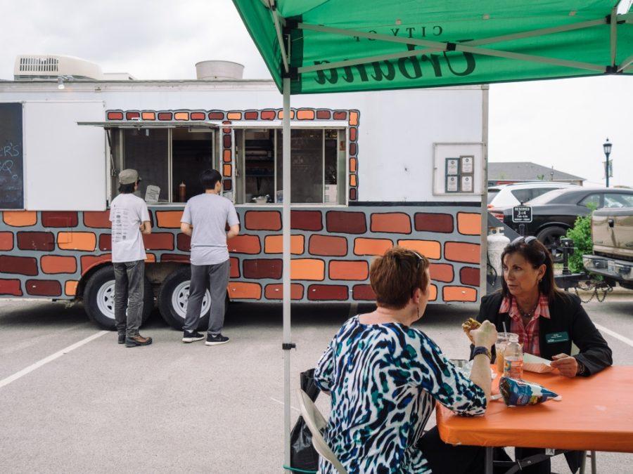 Customers wait in line in front of a food truck at a May 8 rally. The next food truck rally is set for June 27 from 11 a.m. to 2 p.m., and will be located outside of Urbanas Civic Center. 