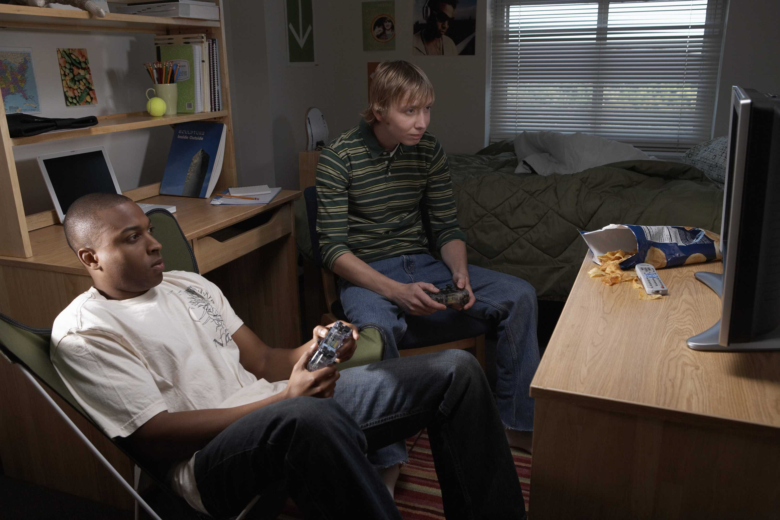 Two Young Men Playing Video Game In Dorm Room The Daily Illini