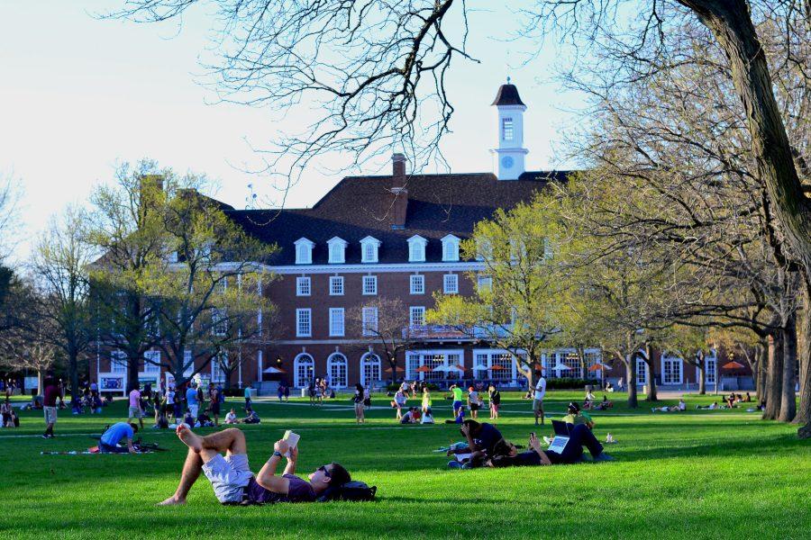 Students relax and gather with friends of the Main Quad on a sunny afternoon.