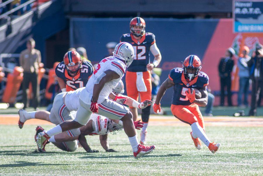 Running back KeShawn Vaughn makes a run during the game against Ohio State at Memorial Stadium on Saturday, Nov. 14. Illinois lost 28-3.
