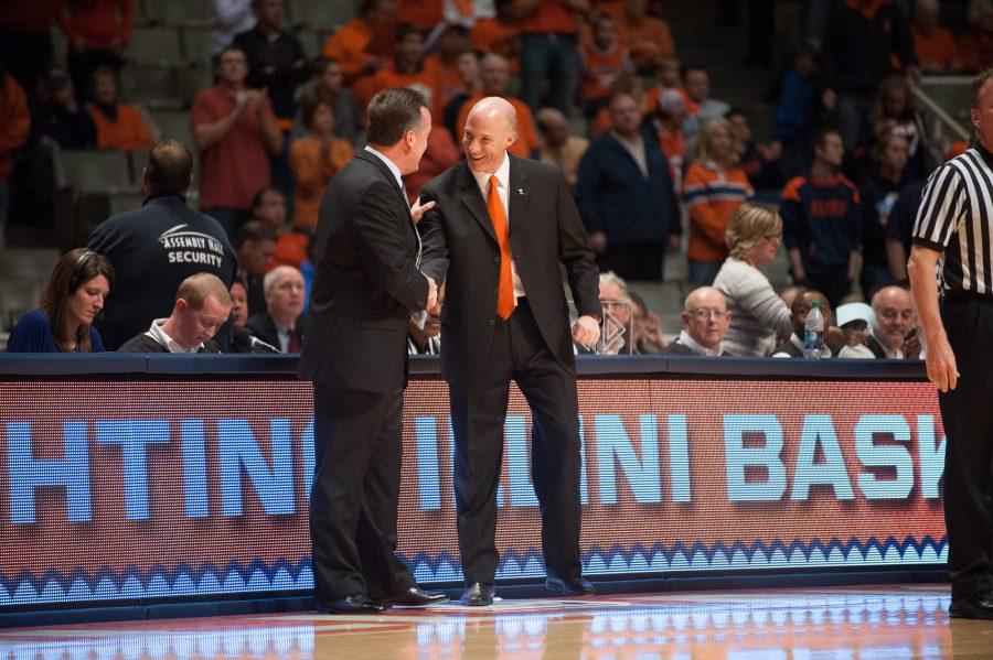 Illinois head coach John Groce shakes hands with Lewis Universitys head coach Scott Trost before the exhibition game, held at Assembly Hall on Saturday, Oct. 27, 2012.