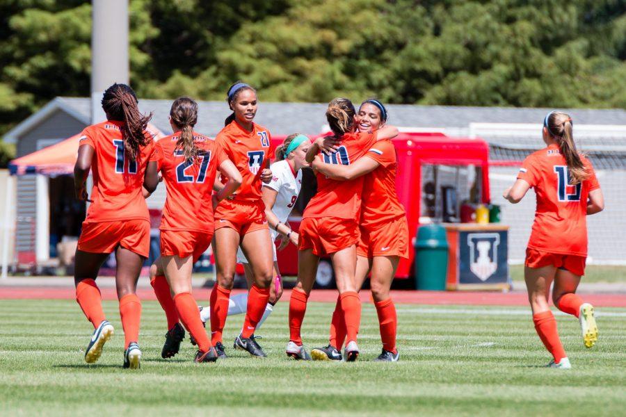 Illinois Allison Stucky (10) gets a hug from Alicia Barker after scoring the only goal in the game against Illinois State at Illnois Soccer Stadium on Sunday, August 21. The Illini won 1-0.
