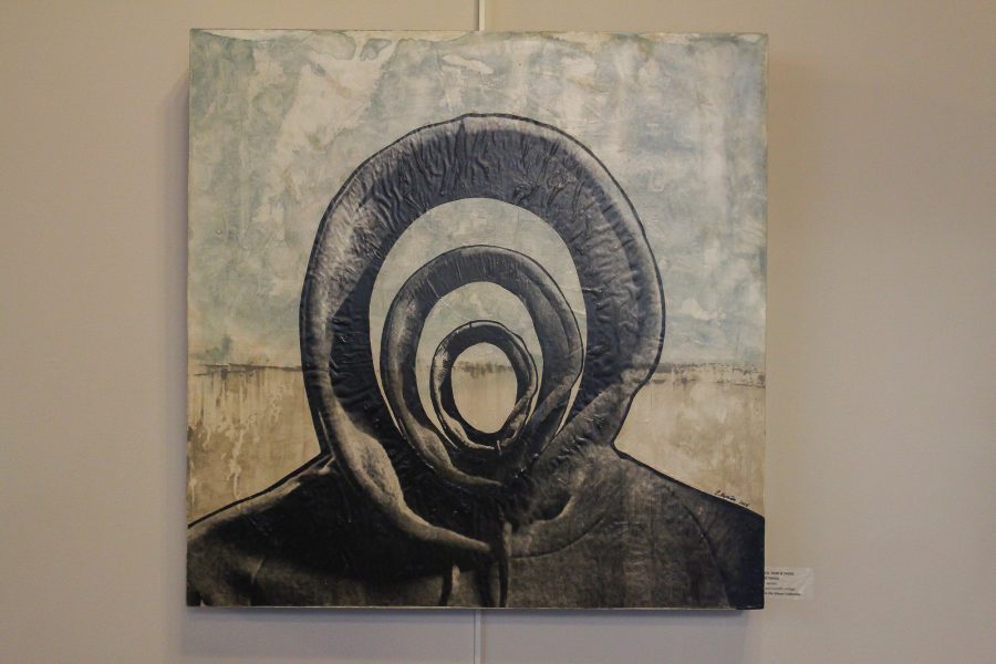 Artwork by Candace Hunter for her exhibit Hooded Truths sits on display at the University YMCA on Wright and Chalmers.