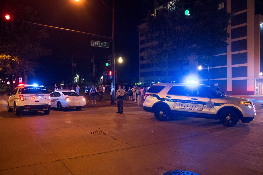 Police cars are parked at the intersection of Green and Fourth Street after a shooting that took place early Sunday morning.