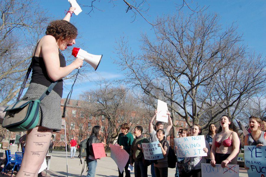 Elizabeth Mucha, a senior in LAS and a member of Amnesty International Chapter 124, rallies supporters of the 2013 Slut Walk to call awareness to sexual assault.