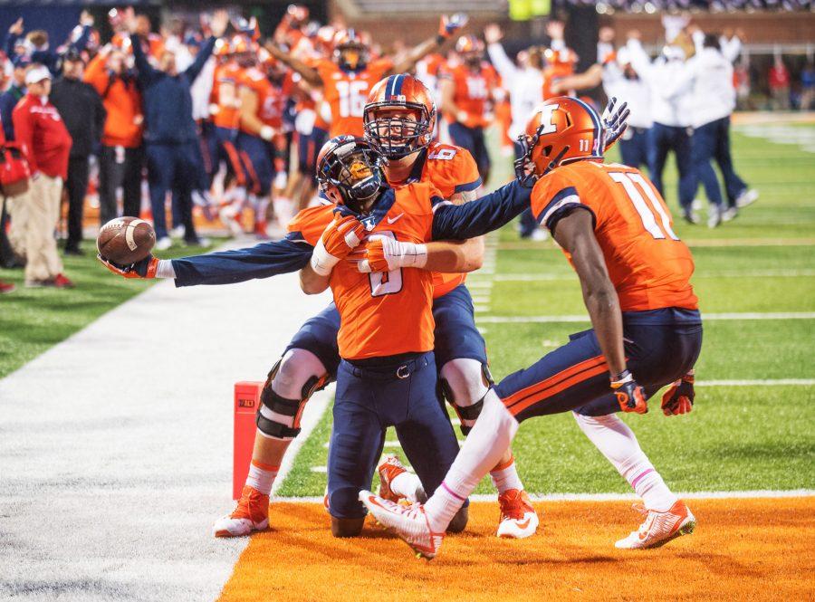 Wide+receiver+Geronimo+Allison+is+embraced+by+teammates+after+catching+the+game-winning+touchdown+pass+with+under+10+seconds+left+in+the+game+against+Nebraska+at+Memorial+Stadium+on+Saturday.+Illinois+won+14-13.