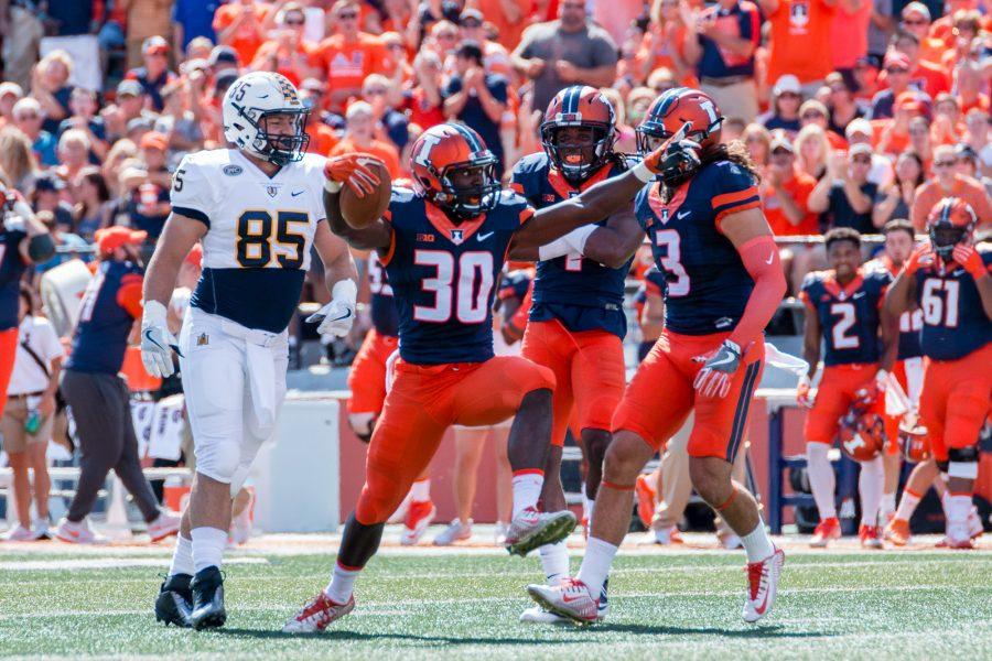Illinois defensive back Julian Hylton (30) celebrates after an interception during the game against Murray State at Memorial Stadium on Saturday, September 3. The Illini won 52-3.