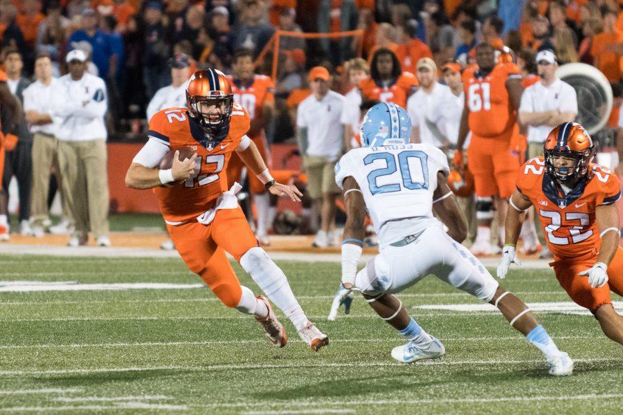 Illinois quarterback Wes Lunt scrambles for a first down against North Carolina at Memorial Stadium on Saturday, September 10. The Illini loss 48-23.