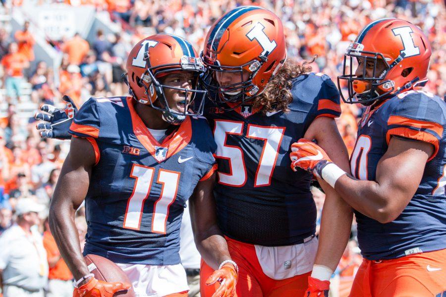 Illinois+wide+receiver+Malik+Turner+%2811%29+celebrates+with+offensive+lineman+Austin+Schmidt+%2857%29+scoring+the+first+touchdown+of+the+game+against+Murray+State+at+Memorial+Stadium+on+Saturday%2C+September+3.+The+Illini+won+52-3.