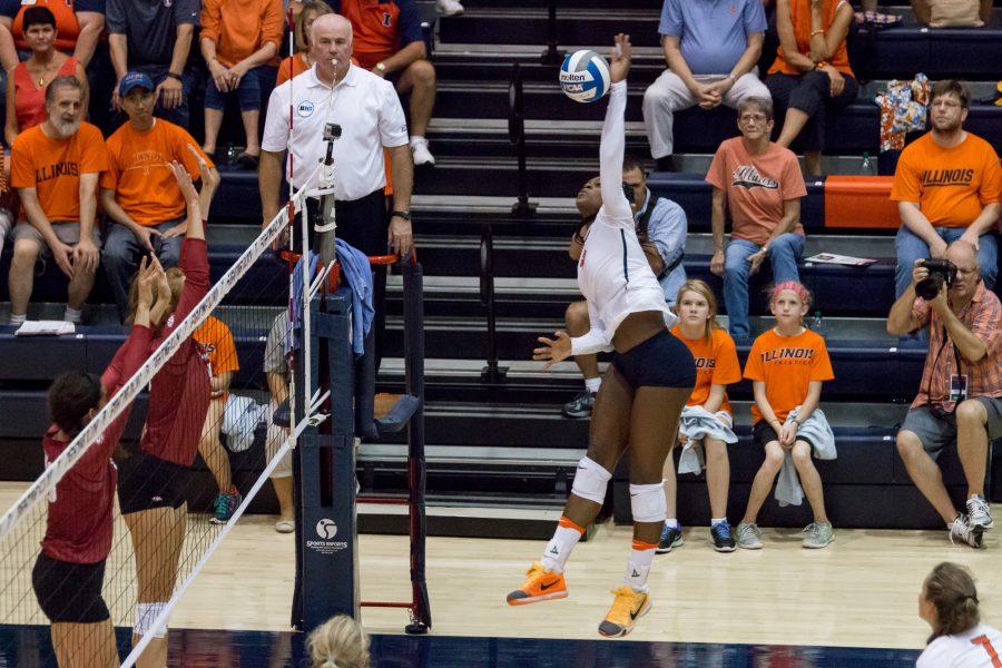 Illinois opposite hitter Naya Crittenden spikes the ball during the match against Arkansas at Huff Hall on Friday, August 26. The Illini won 3-0.