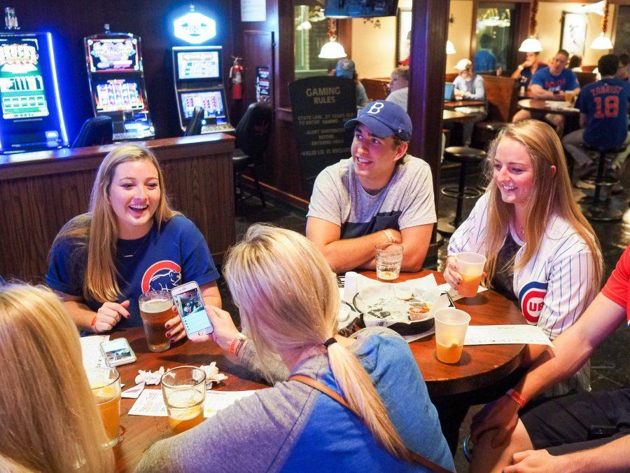 Cubs fans watch the game at Legends Bar on Sunday, October 14, 2016.