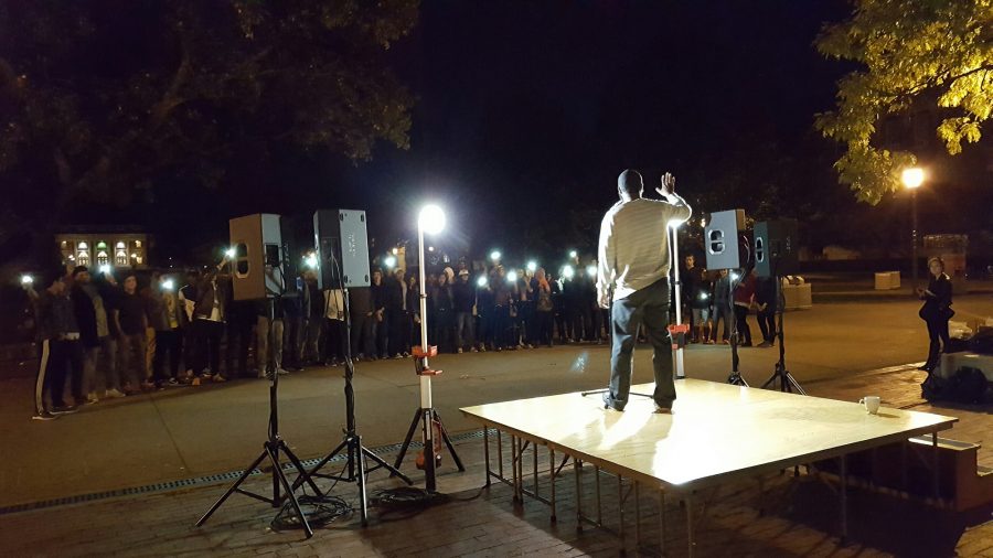 Students shine lights as Khalil Ismail performs as part of the Islam Awareness Week hosted by the Muslim Student Association on campus during the week of October 10.