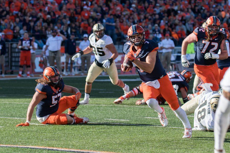 Illinois quarterback Chayce Crouch runs for a touchdown in the game against Purdue at Memorial Stadium on October 8. The Illini lost 34-31.