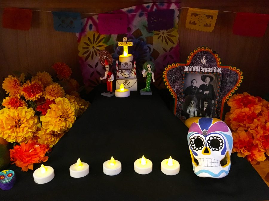 A small calavera (skull) sits as an offering for Dia de los Muertos or Day of the Dead, where people pay their respects to the dead by placing their favorite foods out and lighting their path to the afterlife with candles. 