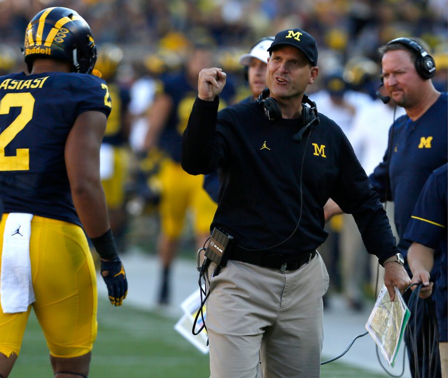 Michigan+head+coach+Jim+Harbaugh+encourages+his+players+coming+off+the+field+late+in+the+first+half+against+Penn+State+at+Michigan+Stadium+in+Ann+Arbor%2C+Mich.%2C+on+Saturday%2C+Sept.+24%2C+2016.+Michigan+won%2C+49-10.