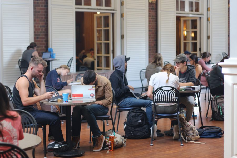 Students sit and do homework in the Courtyard and the Illini Union.
