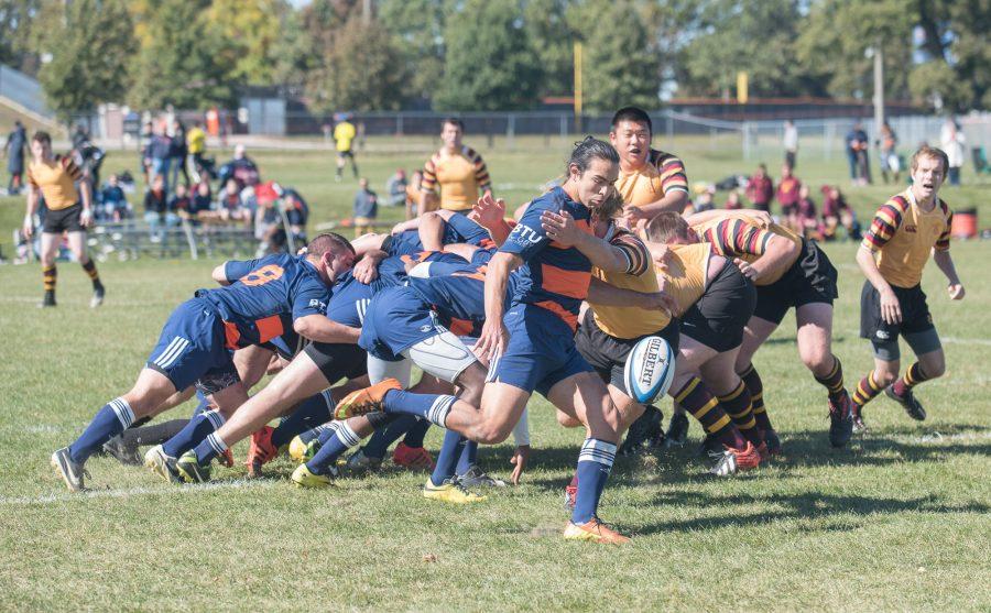 After retrieving the ball from the scrum, Mario Lozano drop kicks the ball down the field during the game against Minnesota at the Complex Fields on Saturday, October 17.