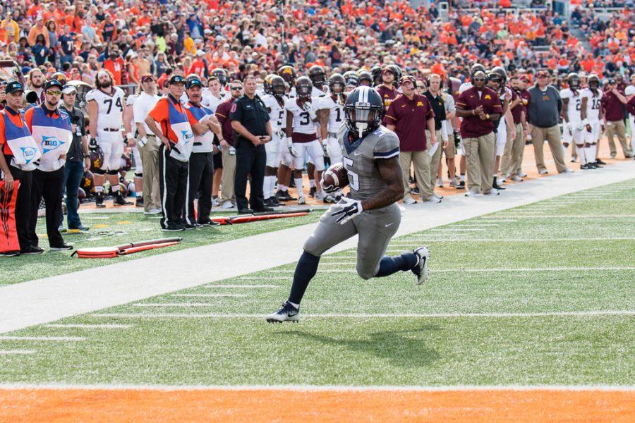 Illinois running back Ke'Shawn Vaughn (5) runs into the end zone for a touchdown during the first half of the game against Minnesota at Memorial Stadium on Saturday, October 29. The Illini are losing 14-7 at half.