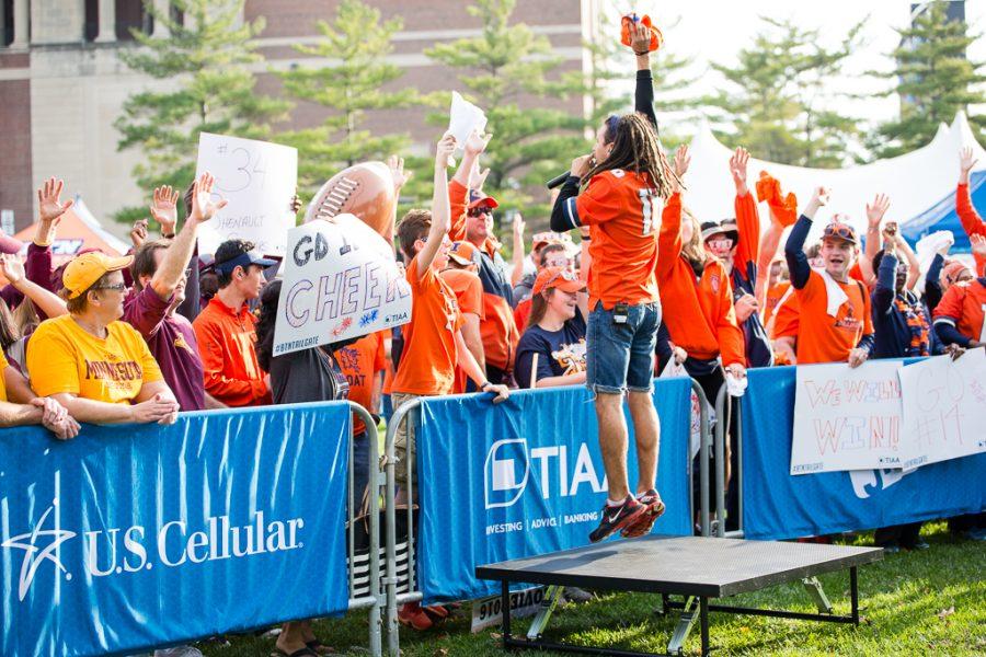 Illini fans dance during the Big Ten Tailgate before the game against Minnesota at Memorial Stadium on Saturday October 29.