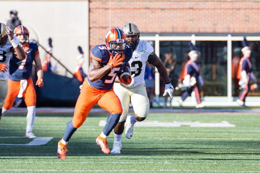 Illinois running back KeShawn Vaughn (5) runs down the field during the game against Purdue at Memorial Stadium on Saturday, October 8. The Illini lost 34-31.