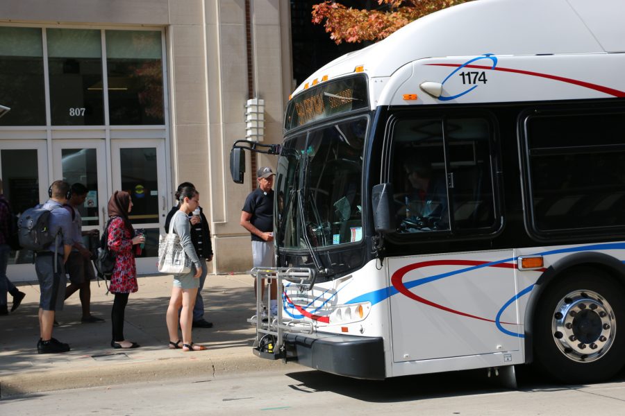 Students board a CUMTD bus at Transit Plaza. MTD’s SafeRides plans to launch its own app in August.