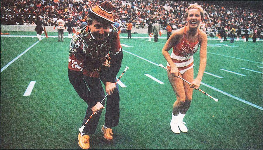 Molly Nicholas, alumni, and her dad show the crowd where she got her talent at the Dads Weekend football game in 1986.