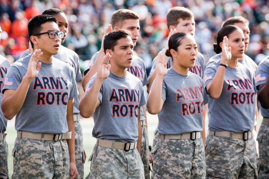 New members of the Army ROTC take the oath of enlistment during the first half of the game against Michigan State at Memorial Stadium on Nov. 5.