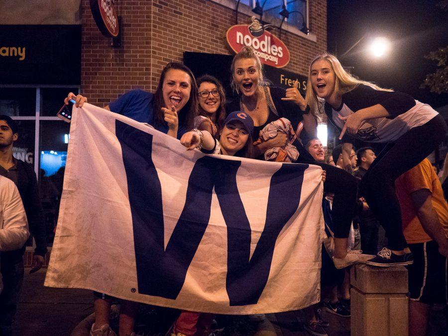 Students celebrate the Chicago Cubs win against the Cleveland Indians during Game 7 of the 2016 World Series on Wednesday, November 2 on Green Street.