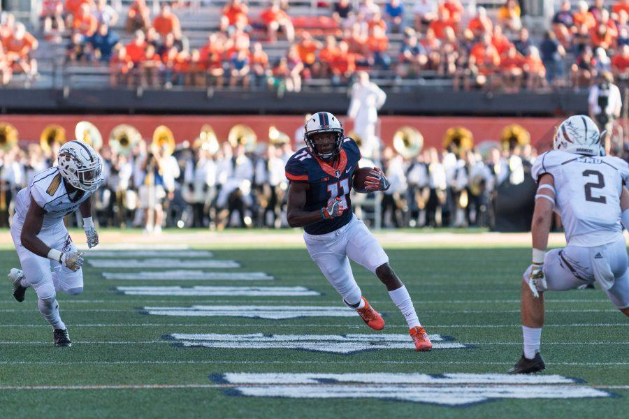 Illinois+wide+receiver+Malik+Turner+weaves+through+defenders+during+the+game+against+Western+Michigan+at+Memorial+Stadium+on+Saturday%2C+September+17.+The+Illini+lost+34-10.