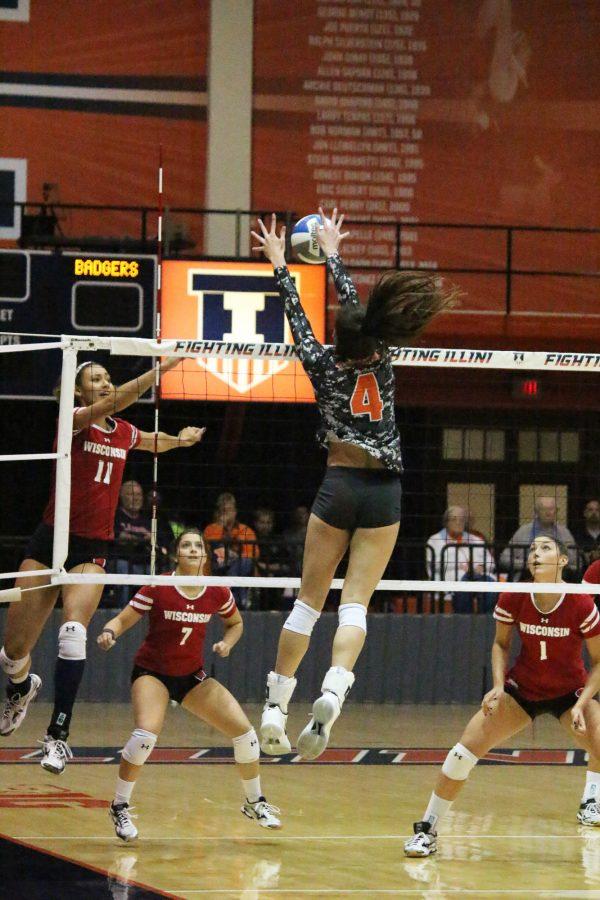 Michelle Strizak jumps up alone to block the spike from Wisconsin at Huff Hall on Friday, Nov. 11, 2016. Illini lost to Wisconsin 0-3.