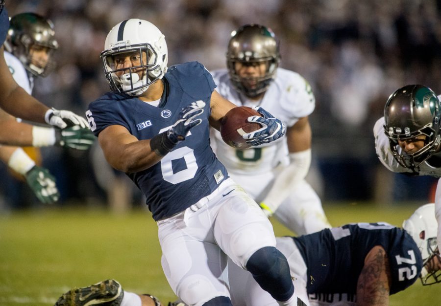 Penn State running back Andre Robinson darts past Michigan State defenders for a fourth-quarter touchdown at Beaver Stadium in University Park, Pa., on Saturday, Nov. 26, 2016. Penn State won, 45-12. (Abby Drey/Centre Daily Times/TNS)