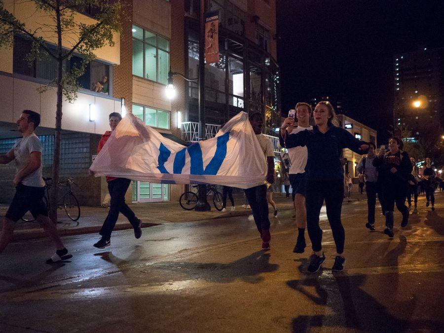 Students celebrate after the Cubs win Game 7 of the 2016 World Series against the Cleveland Indians on Wednesday, November 2 on Green Street at the University of Illinois at Urbana- Champaign.