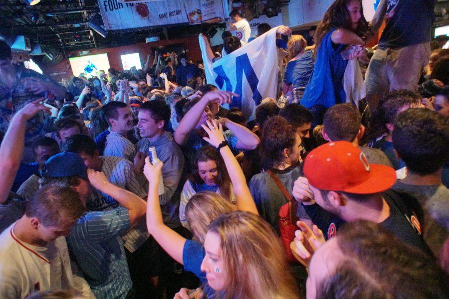 Students celebrate after the Cubs win Game 7 of the 2016 World Series against the Cleveland Indians on Wednesday, November 2 at Kams.