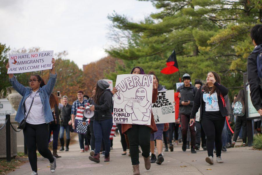 Students gather at Alma Mater to march through the Main Quad and down Green Street in order to protest President-elect Donald Trump on Friday.