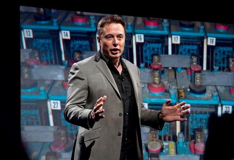 In this April 30, 2015 file photo, Tesla Motors CEO and SpaceX CEO and CTO, Elon Musk, introduces a new line of residential and commercial batteries to a crowd of invited guests, media and Tesla fans at the automaker's design studio in Hawthorne, Calif. 