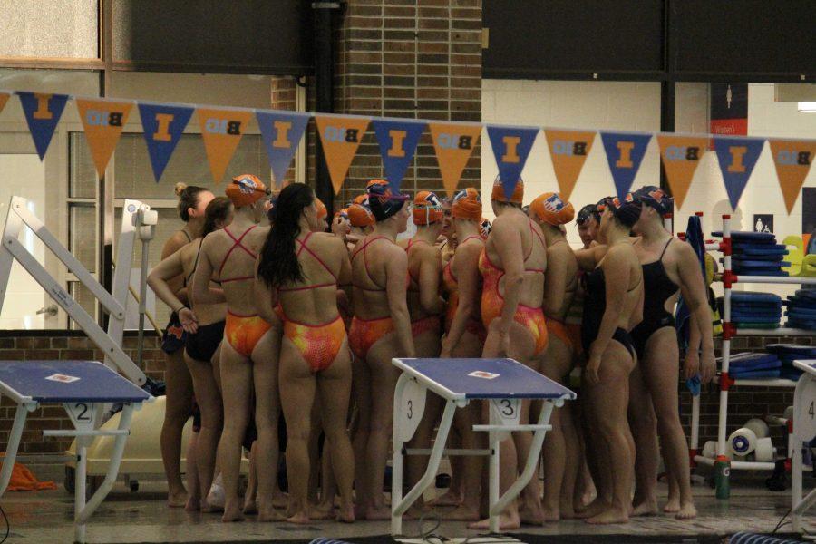 The Illini swim team gathers together during the Orange and Blue Meet on October 7. 